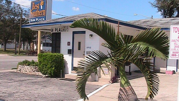 A building with a sign reading "Best Southern Sun Plaza."