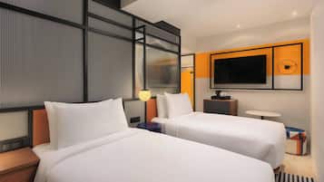 Hypo-allergenic bedding, down duvets, pillow-top beds, in-room safe