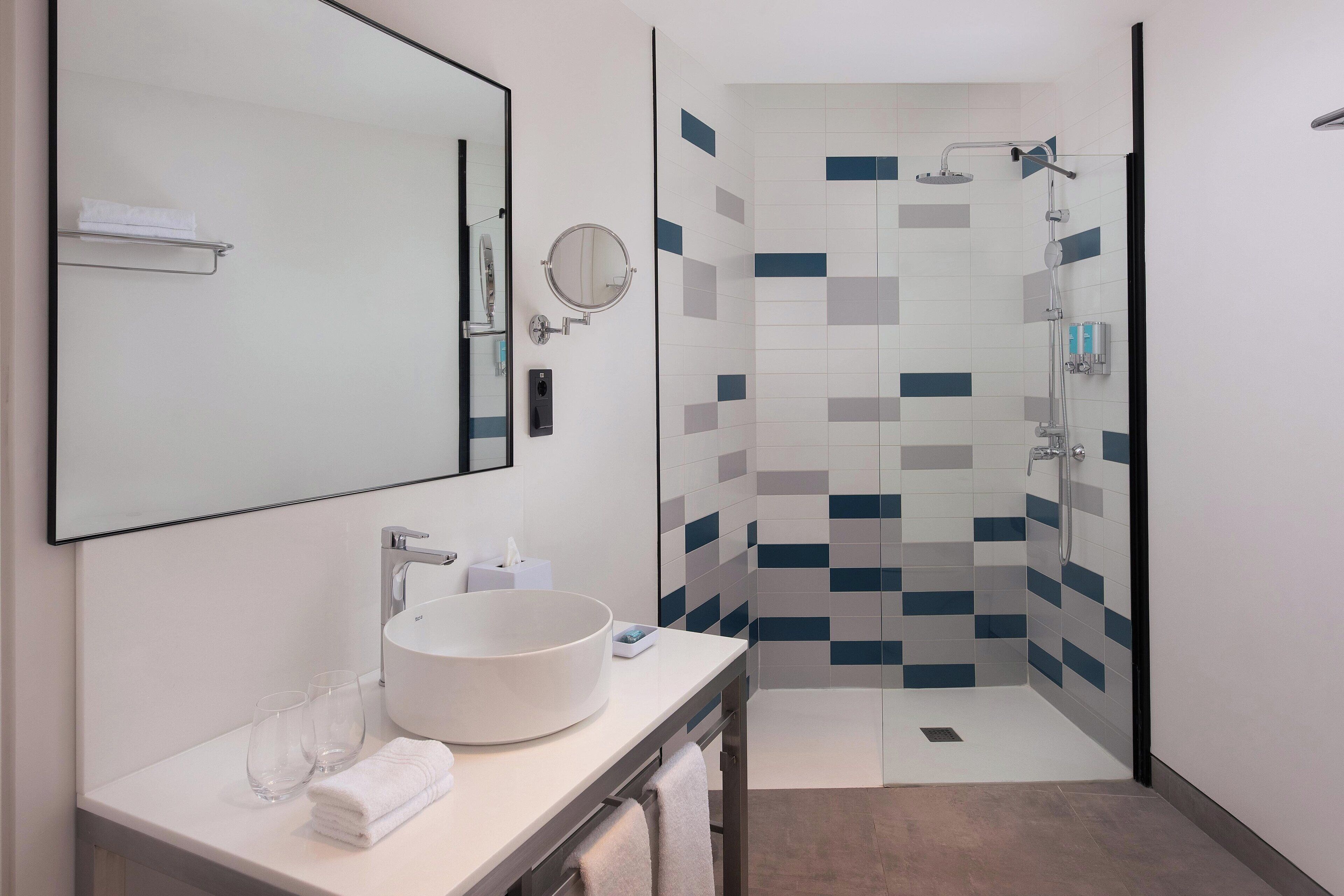 aloft, premium room | bathroom | shower, free toiletries, hair dryer, towels