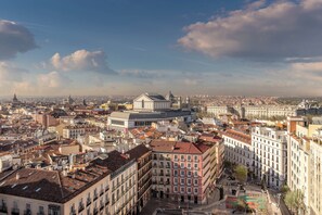 A cityscape with historic buildings, a prominent dome, and a mix of architectural styles. - Aloft by Marriott Madrid Gran Via (Madrid)