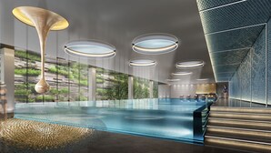 A modern indoor pool area with glass walls, a central pool, and multiple ceiling lights. - Sheraton Shenzhen Nanshan (Shenzhen)