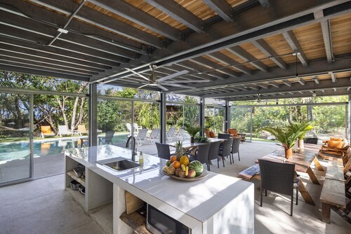 Five Bungalows, Swimming Pool and Amenities Amidst a Beachfront Forest.