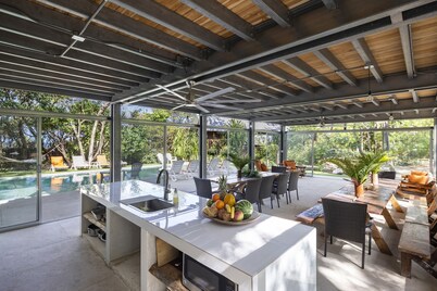 Five Bungalows, Swimming Pool and Amenities Amidst a Beachfront Forest.