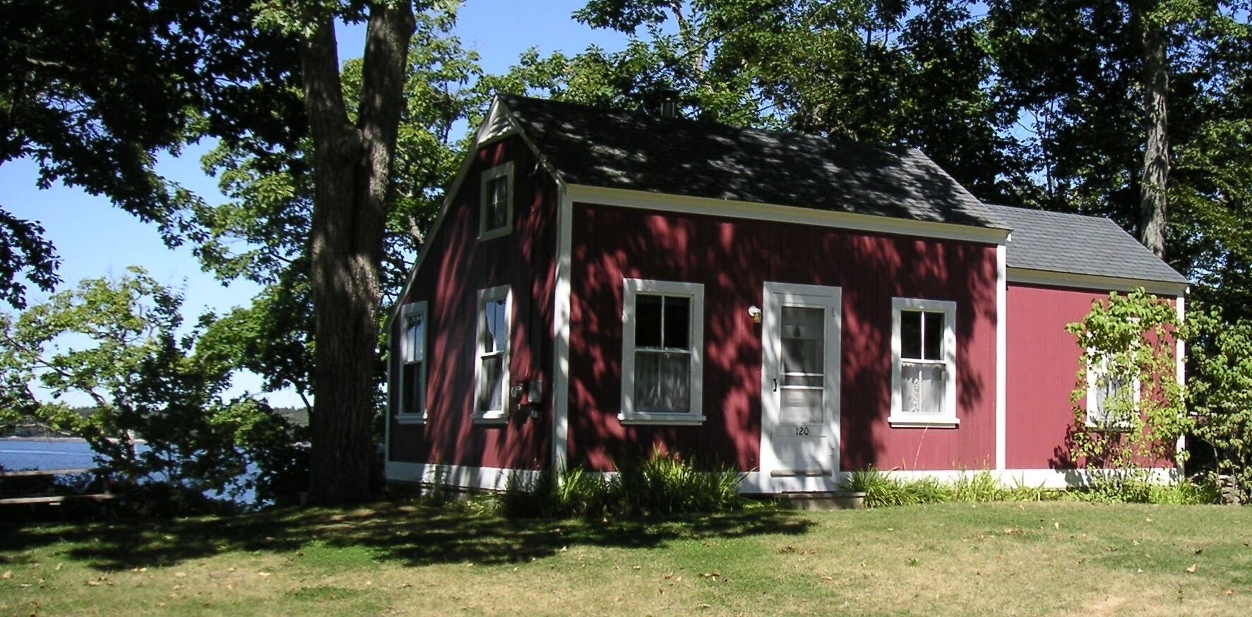 Front of cottage with ocean in backgound