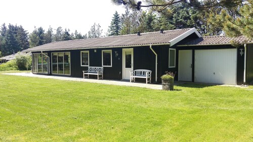 A wooden house on the beautiful West Coast with the width beautiful beaches.