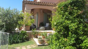 A house with a tiled roof, a covered porch, and potted plants. - Detached villa with good amenities, private pool, close to Aix en Provence (Coudoux)