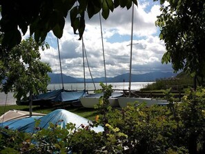 Enjoy serene lakeside views and picturesque mountains from a relaxing gazebo.