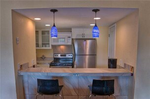 Superior Condo | Private kitchen | Full-size fridge, microwave, oven, stovetop
