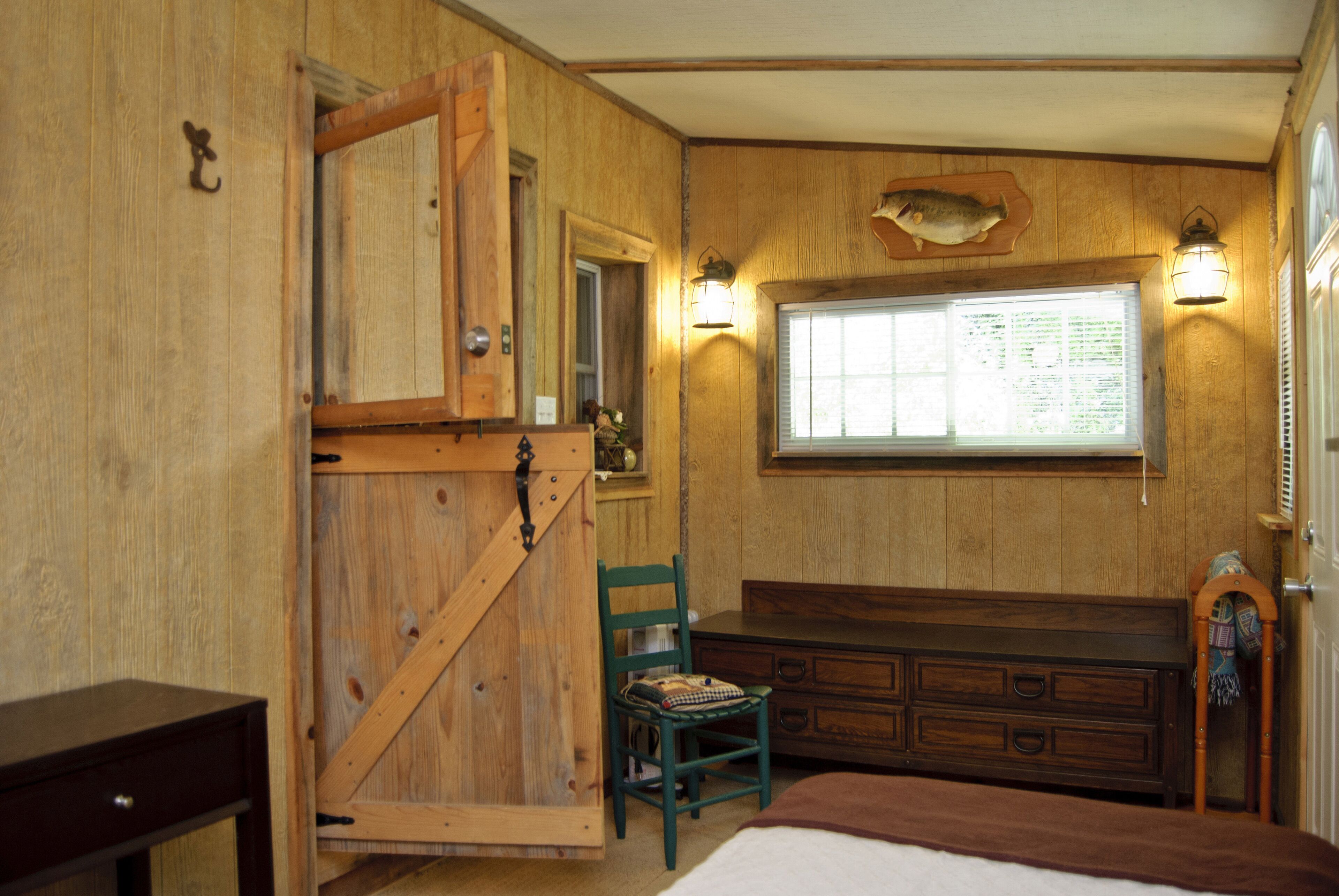 Bedroom with dutch door and four draw dresser