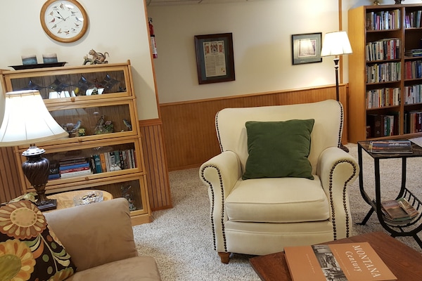Chair or Couch for conversation, tv or a phone call.  Lots of books.