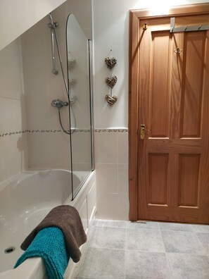 Combined shower/tub, hair dryer, towels, toilet paper