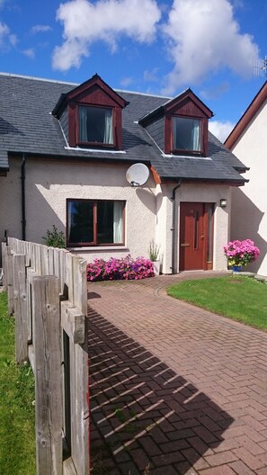 Driveway for two vehicles. Entrance to house. 