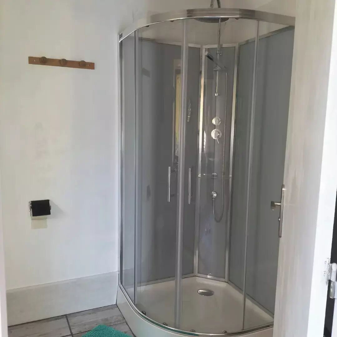 Shower, towels, soap, toilet paper