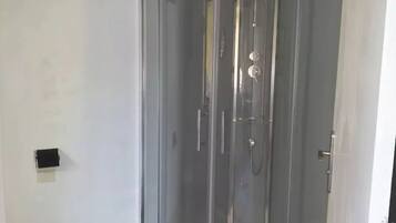 Shower, towels, soap, toilet paper
