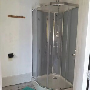 Shower, towels, soap, toilet paper