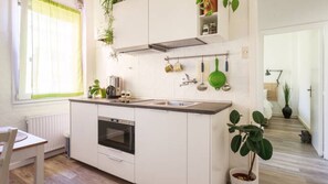 Fridge, microwave, stovetop, coffee/tea maker