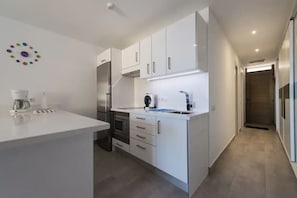 Fridge, microwave, stovetop, coffee/tea maker