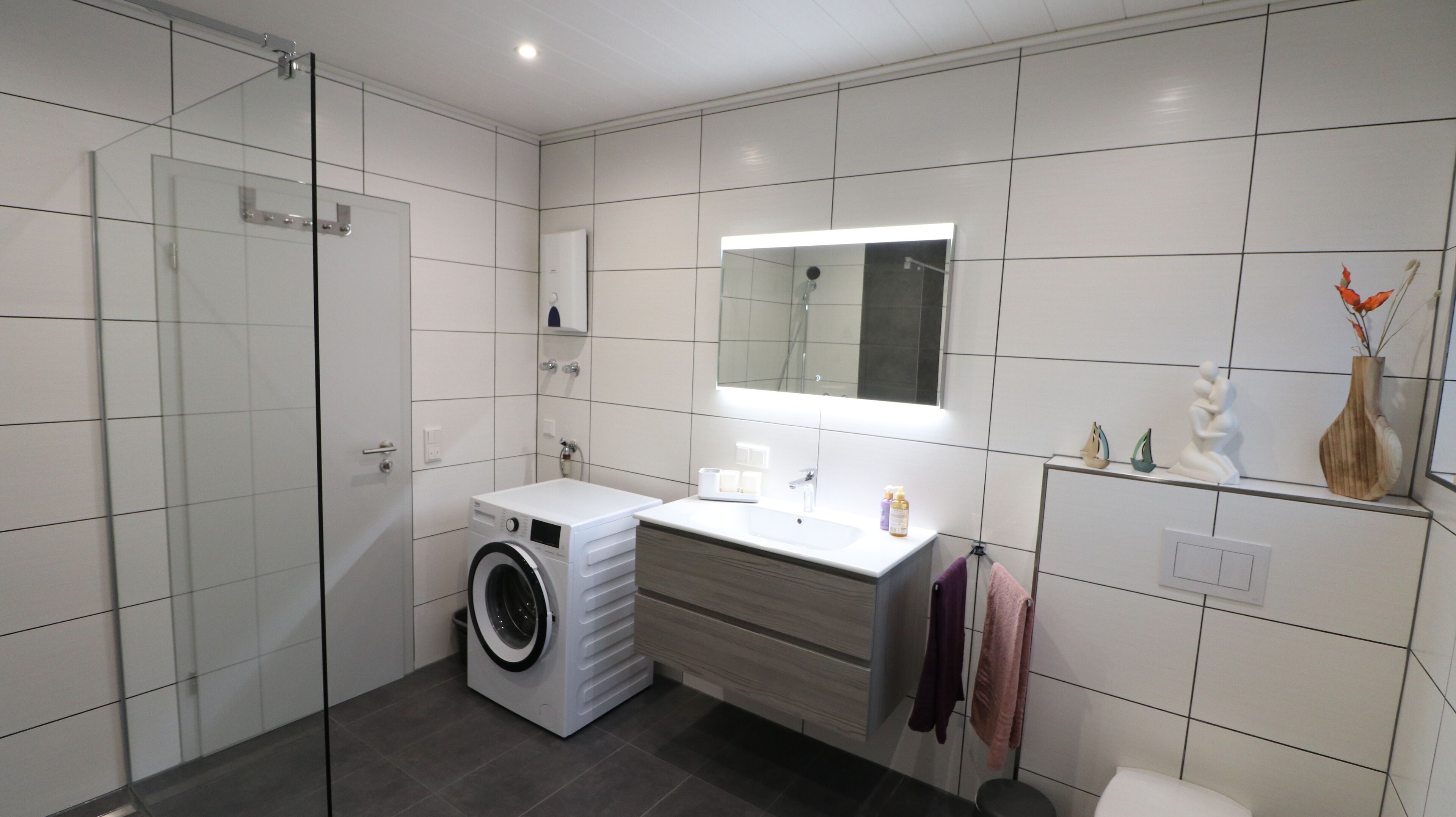 Bathtub, hair dryer, towels, soap
