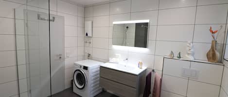 Bathtub, hair dryer, towels, soap