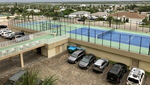 A multi-level parking structure with several cars parked.