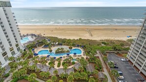 A resort with a swimming pool, beach access, and high-rise buildings. - Royale Palms 1402 2 Br Oceanfront in Kingston,Pool (Myrtle Beach)