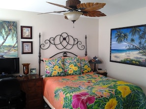 A bedroom with a bed, a ceiling fan, a TV, and artwork on the walls. - Be Home With A View. Close To All The Socal Attractions. Sleeps 8 (Lake Elsinore)
