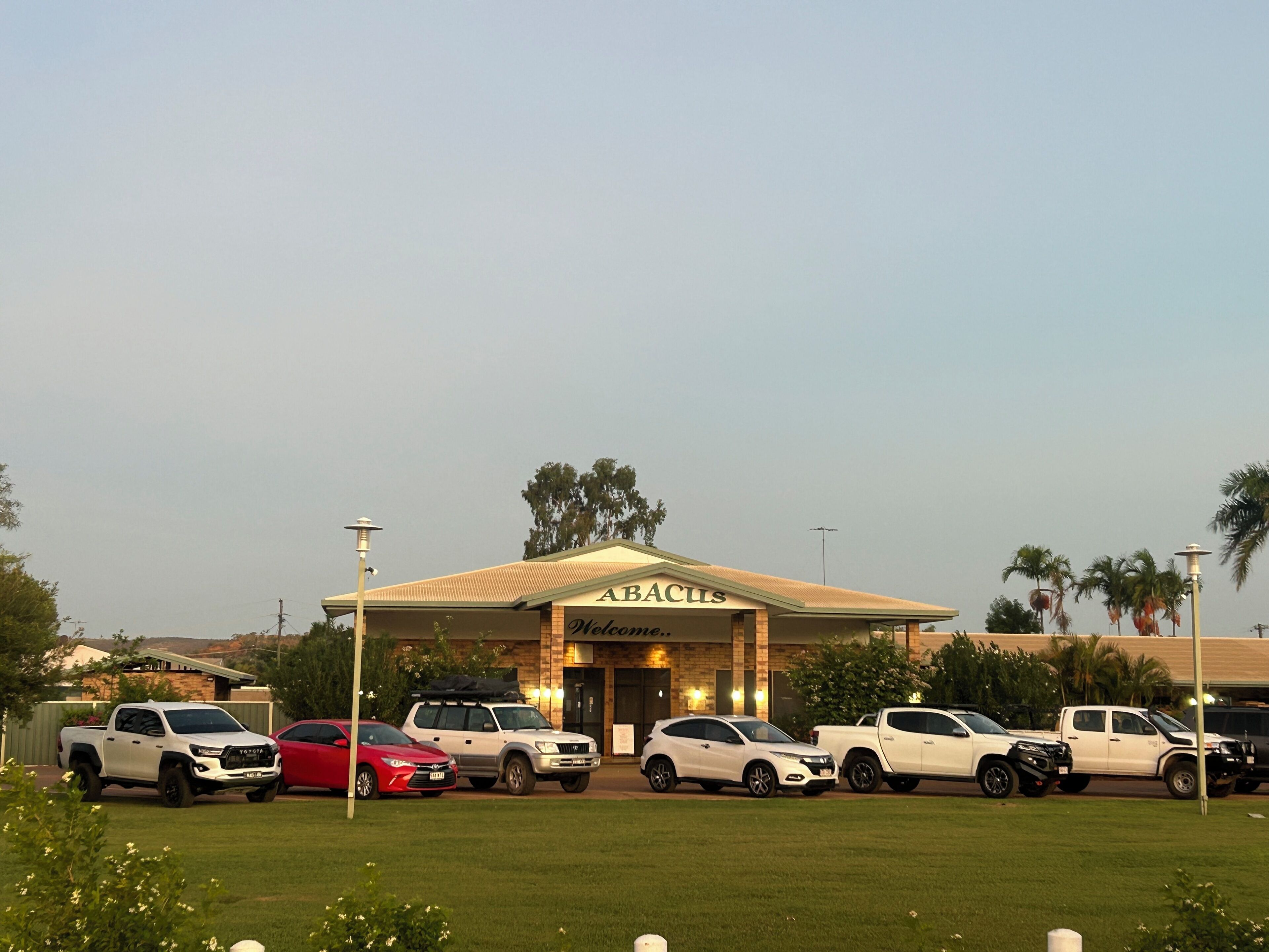 A building with a sign reading "ABACUS Welcome".
