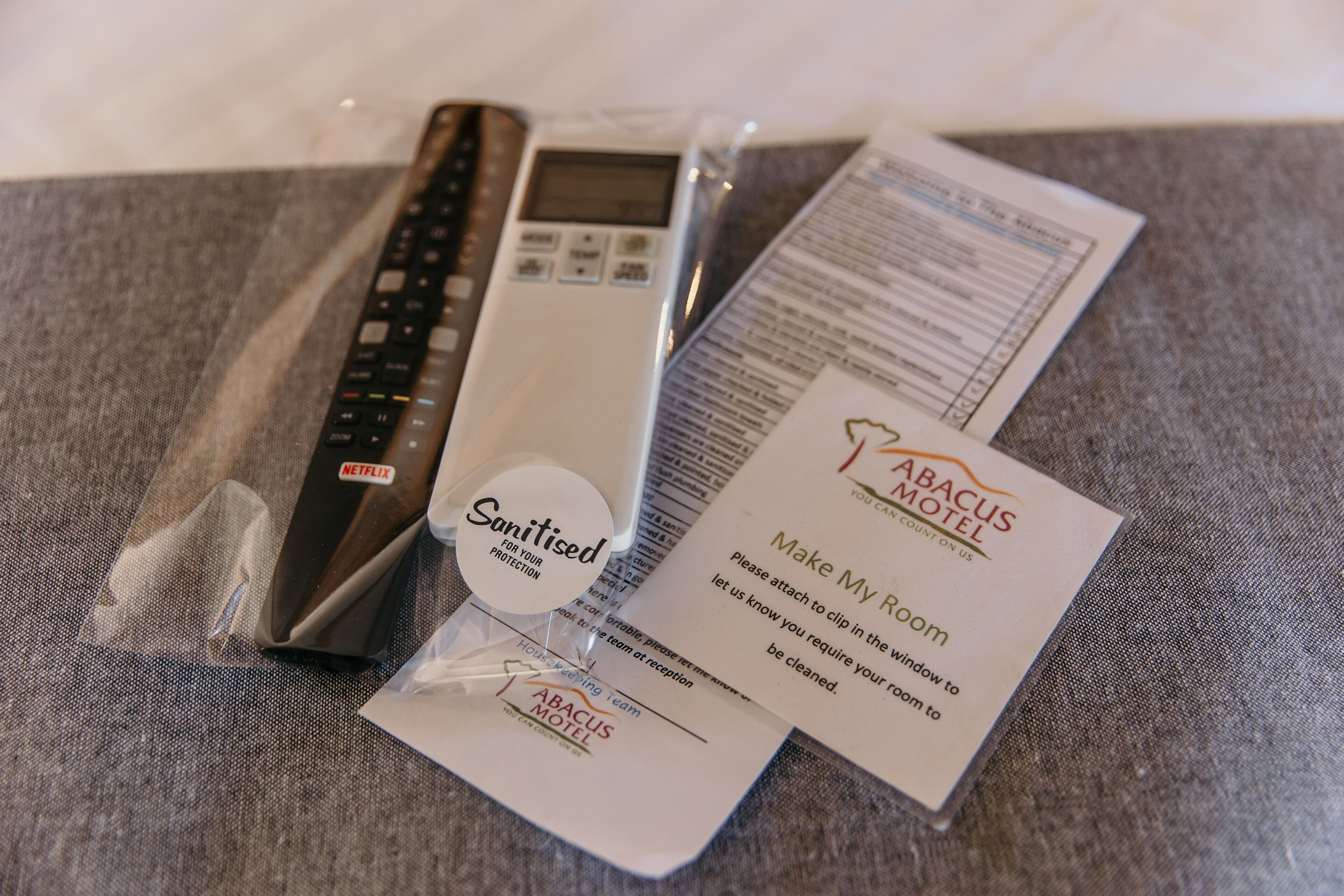 A set of toiletries including a toothbrush, a razor, a comb, and a hand sanitizer.