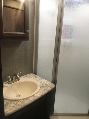 Shower, hair dryer, towels, soap