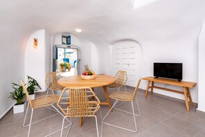 Grand House, 2 Bedrooms, 2 Bathrooms, Courtyard Area | Living area | Flat-screen TV - Santorini Caves (Santorini)