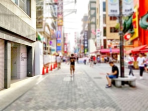 A street view with a building labeled "Dotonbori Hotel" on the left. - S-Dotonbori Hotel Namba (Osaka)