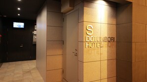 A hotel entrance with a sign reading "S DONINBORI HOTEL". - S-Dotonbori Hotel Namba (Osaka)