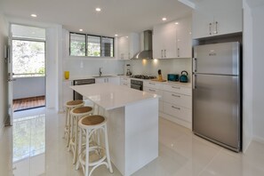 Apartment, 2 Bedrooms, Sea View | Private kitchen | Full-size fridge, microwave, oven, stovetop