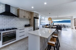 Apartment, 2 Bedrooms, Sea View | Private kitchen | Full-size fridge, microwave, oven, stovetop