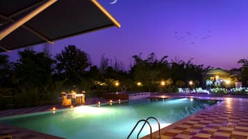 Outdoor pool, open 7:00 AM to 9:00 PM, pool umbrellas