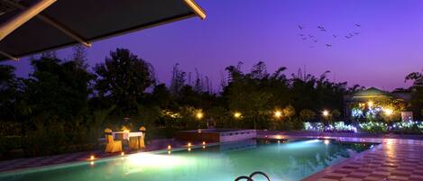 Outdoor pool, open 7:00 AM to 9:00 PM, pool umbrellas