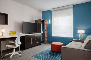 En 55-tommers Flatskjerm-TV med kabel-kanaler samt TV