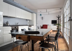 Enjoy meals in the spacious kitchen with a large island and dining area.