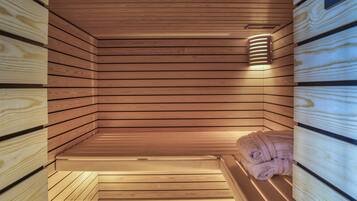 A sauna with wooden walls and a bench.