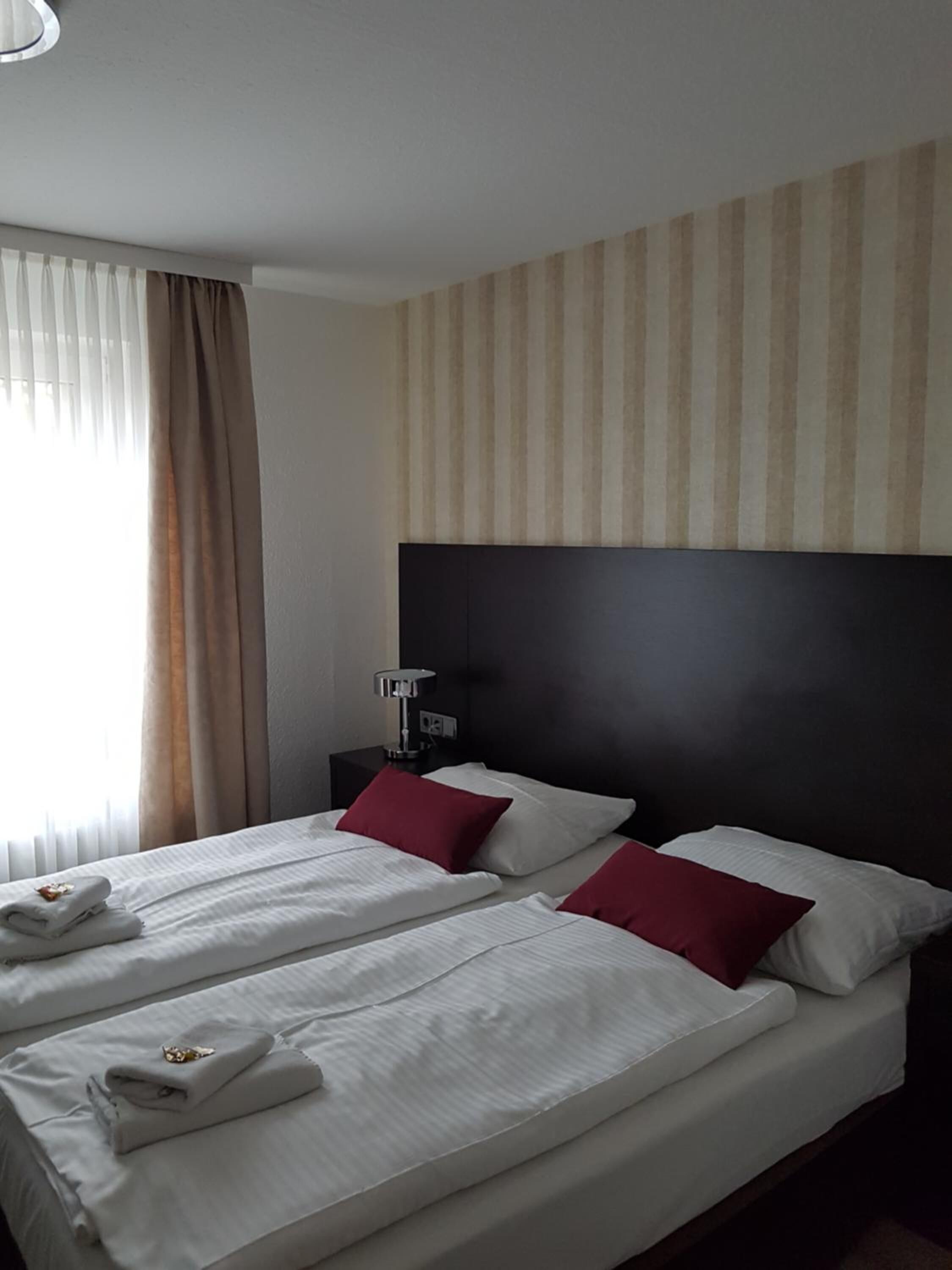 hypo-allergenic bedding, desk, rollaway beds, free wifi