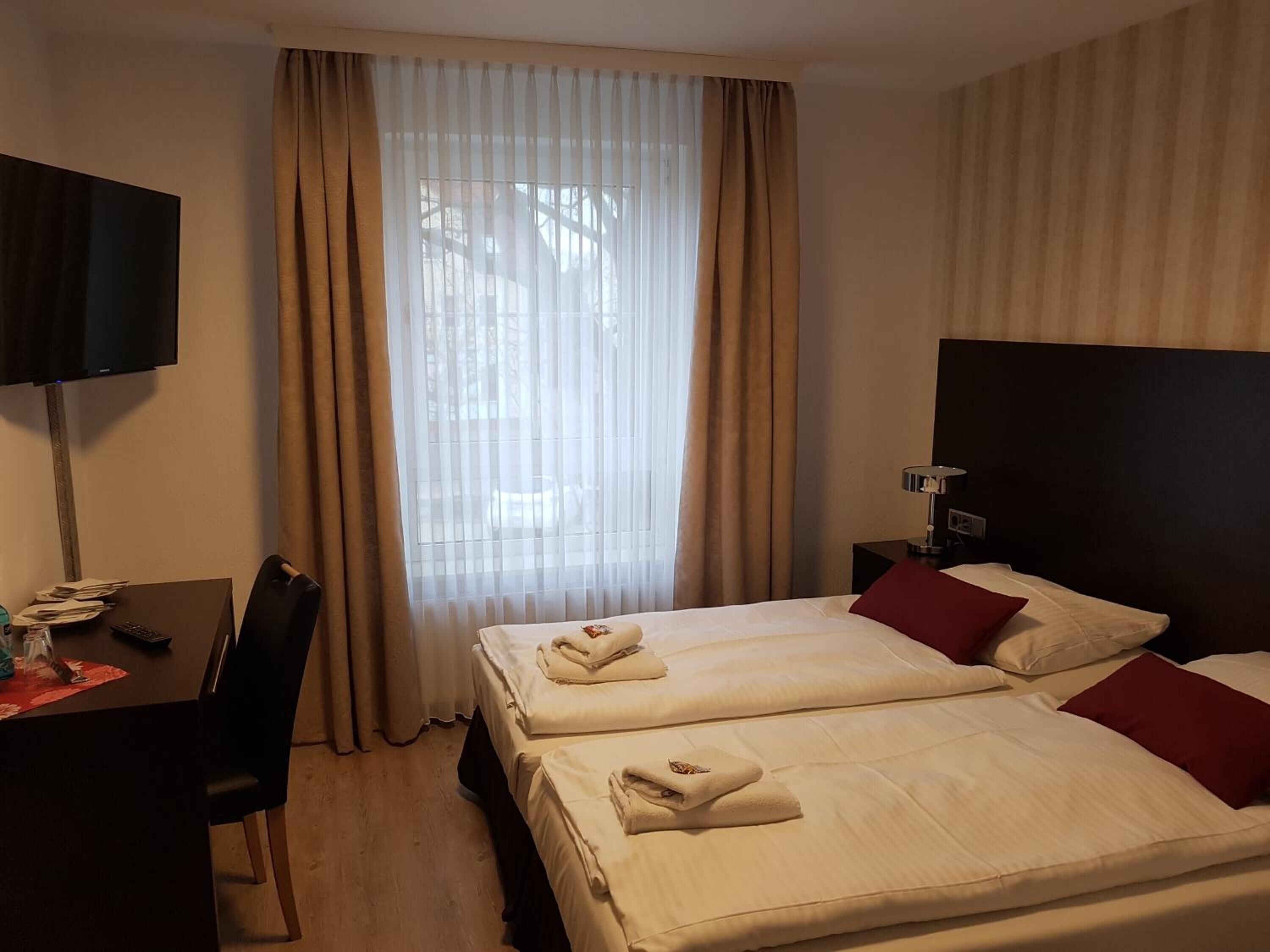 hypo-allergenic bedding, desk, rollaway beds, free wifi