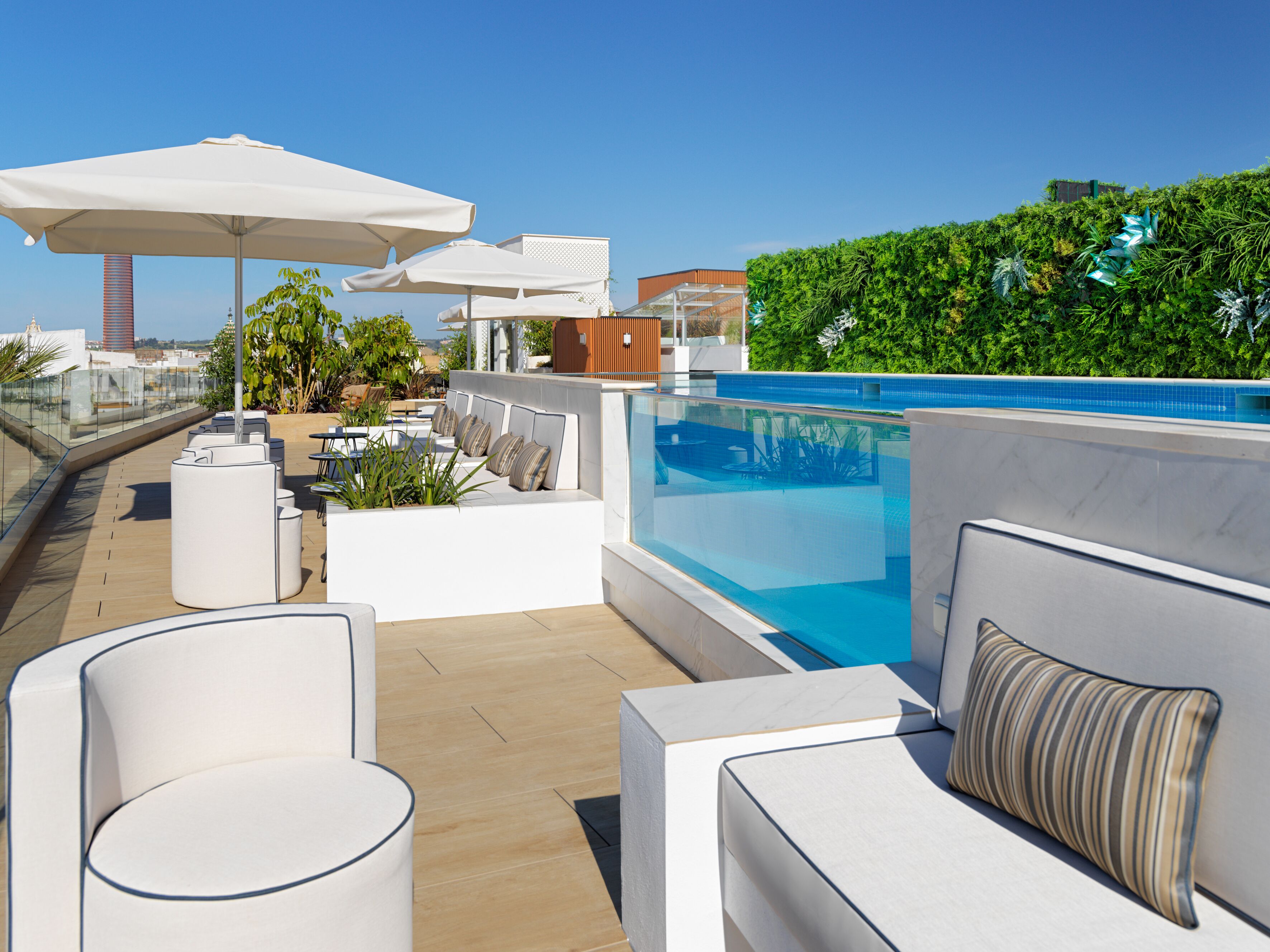 outdoor pool, open 11:00 am to 8:00 pm, pool umbrellas, pool loungers