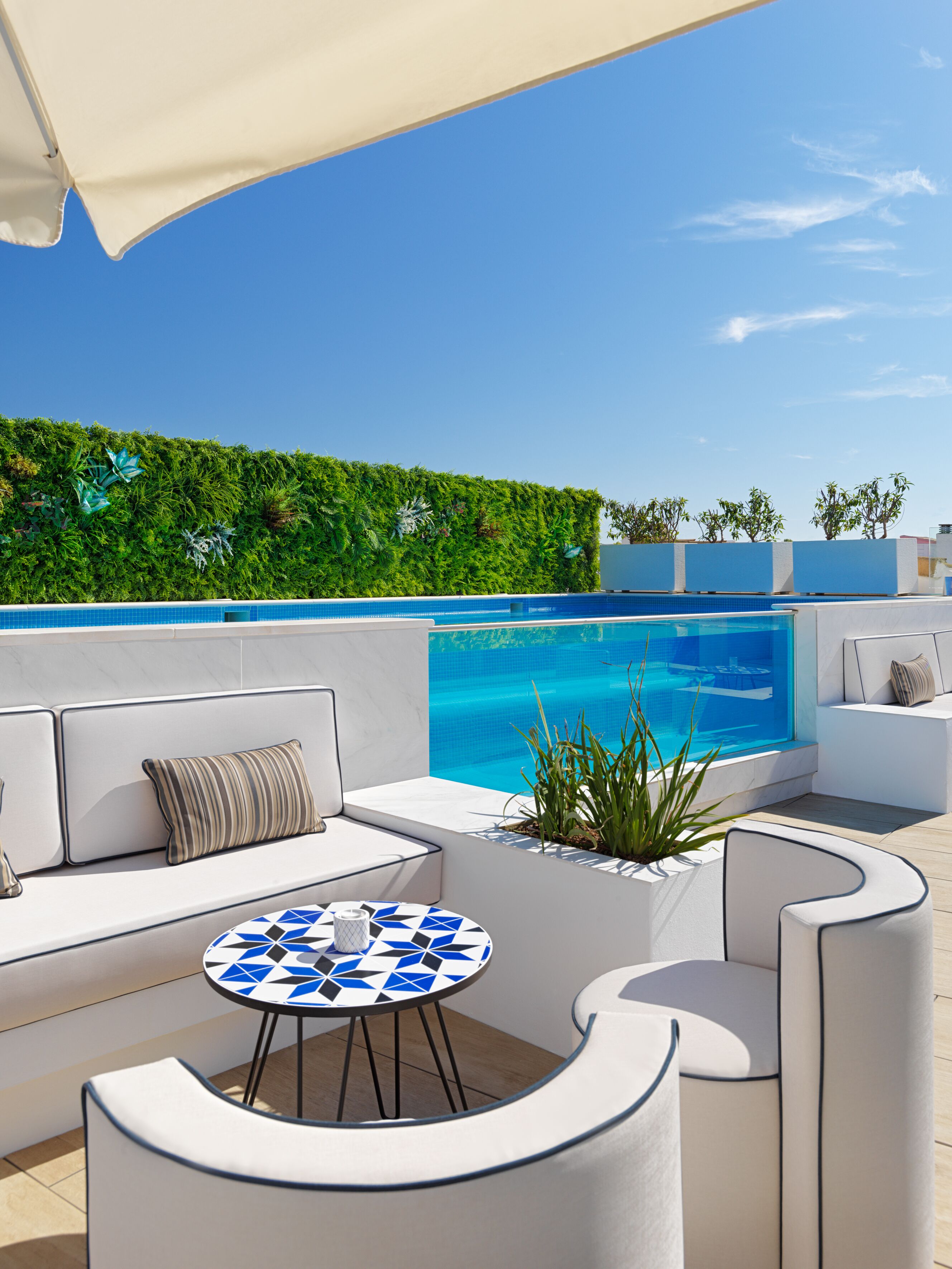 outdoor pool, open 11:00 am to 8:00 pm, pool umbrellas, pool loungers