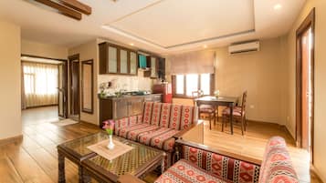 Superior Apartment, 1 Bedroom, Kitchenette, Garden View | Living area | 32-inch LED TV with digital channels, TV, fireplace