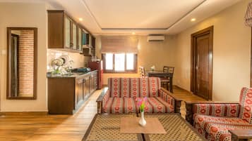 Superior Apartment, 1 Bedroom, Kitchenette, Garden View | Minibar, in-room safe, individually decorated, individually furnished