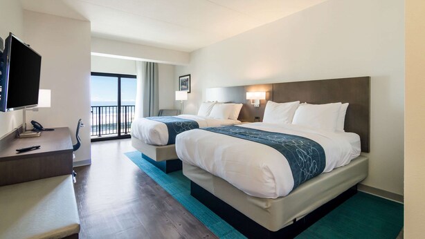 A hotel room with two beds, a desk with a telephone, and a television. - Comfort Inn & Suites Gulf Shores East Beach near Gulf State Park (Gulf Shores)