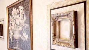 A wall with ornate, gold-framed mirrors and a framed floral artwork. - Grand Court Namba 501 (Osaka)