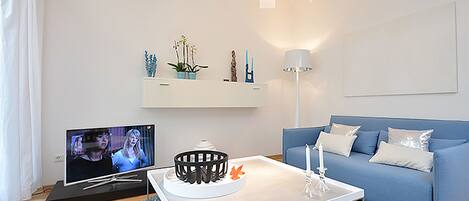 Apartamento luxo (Damai) | Área de estar | TV de tela plana, DVD player, dock para iPod