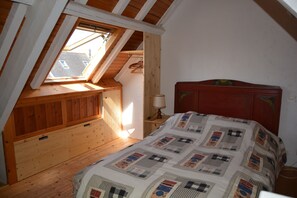1 bedroom, desk, iron/ironing board, travel crib