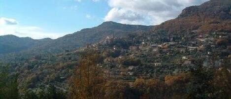 A mountainous landscape with a town nestled in the valley.